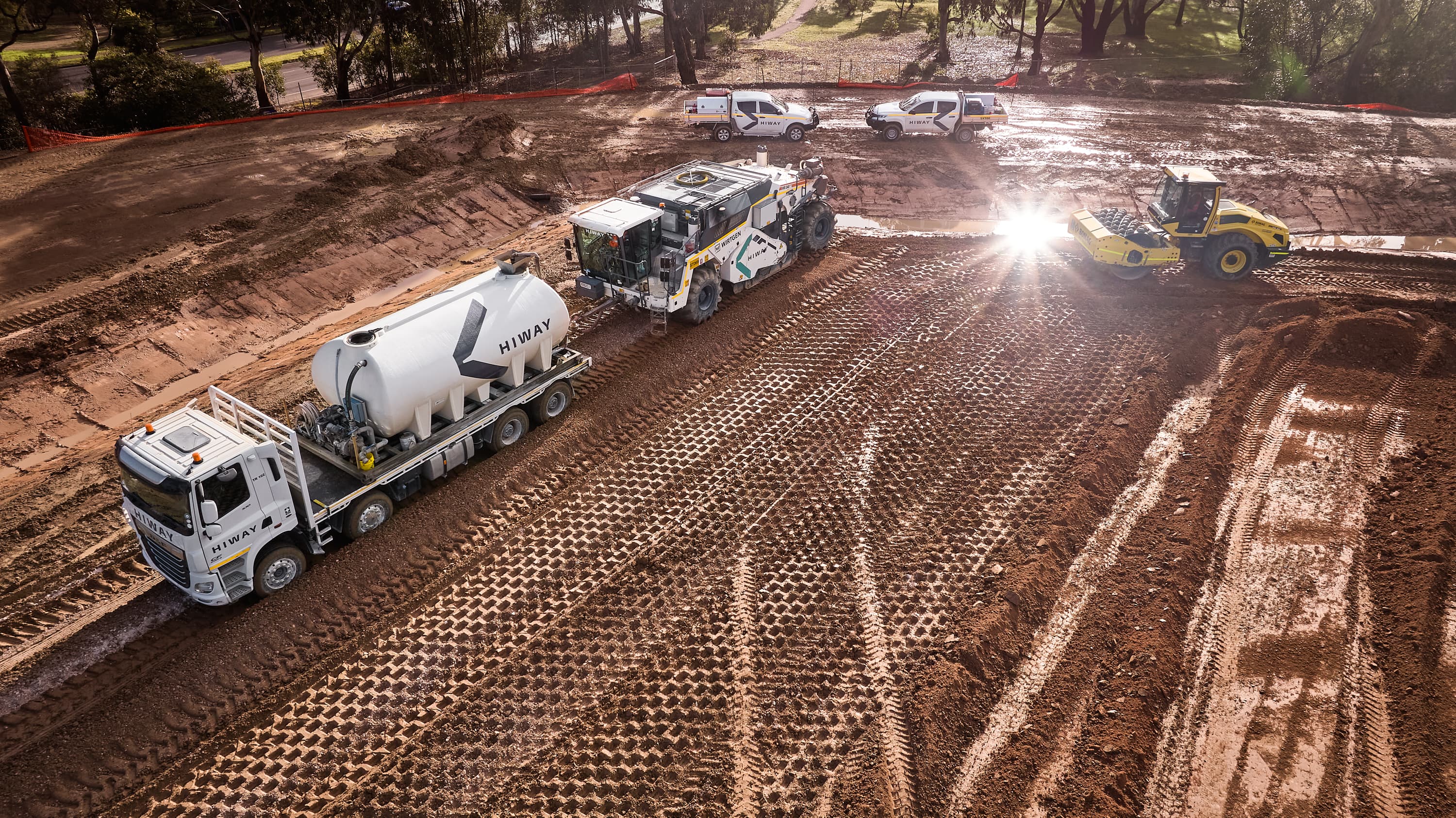 A truck resurfacing a road
