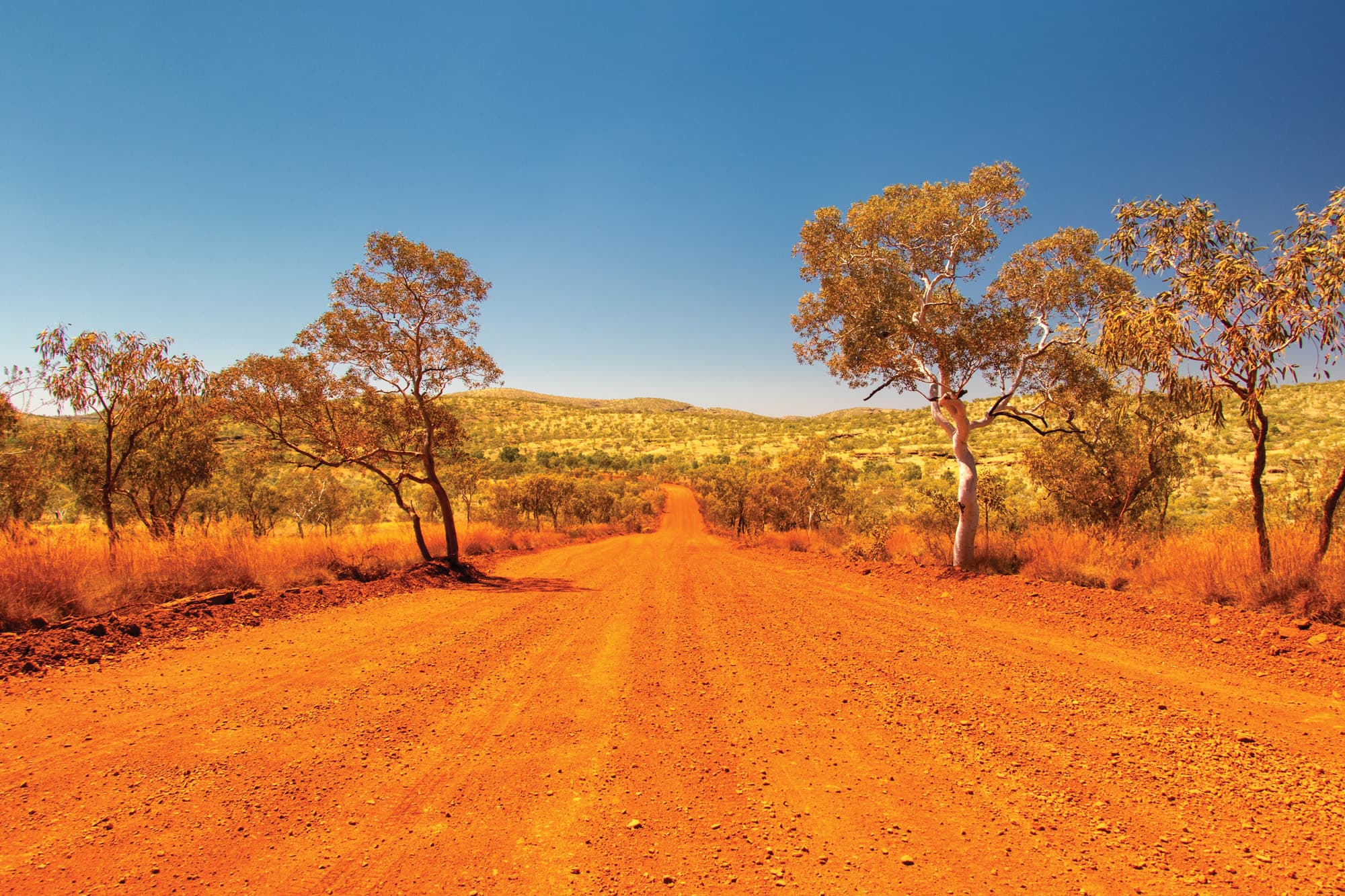 A dusty red road in outback Australia